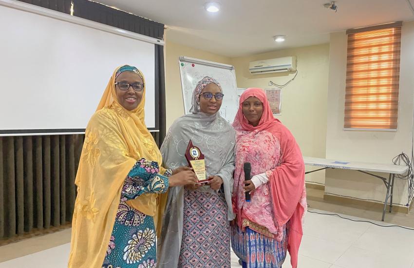 ACEPHAP Director, Prof. Galadanci (1st left) with one of the best researcher (middle) displaying the award