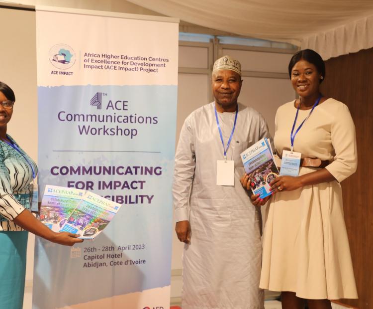 ACEPHAP Communication Officer, Bala Garba Abdullahi presenting copies of the maiden edition of ACEPHAP Newsletter to ACE IMPACT AAU Communication Officer, Ms. Milicent while ACE IMPACT AAU director of ICT, Ms. Nodumo Dlamini displays more copies.